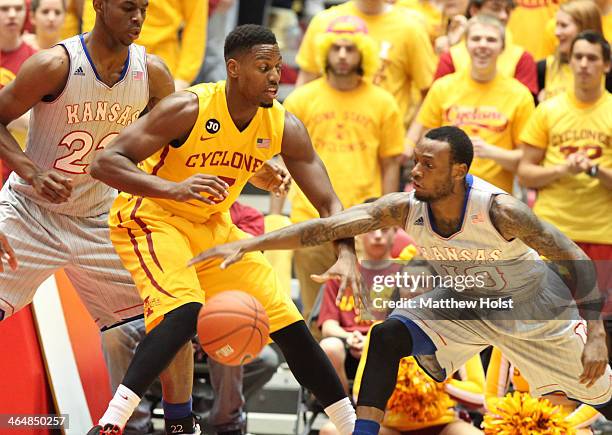 Guard Naadir Tharpe of the Kansas Jayhawks steals the ball during the first half from forward Melvin Ejim of the Iowa State Cyclones on January 13,...