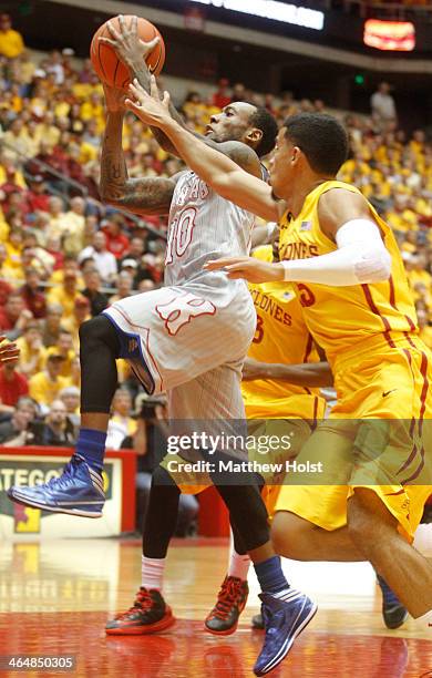 Guard Naadir Tharpe of the Kansas Jayhawks goes to the basket during the first half against guard Naz Long of the Iowa State Cyclones on January 13,...