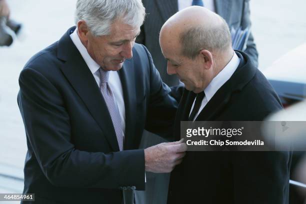 Defense Secretary Chuck Hagel greets French Defense Minister Jean-Yves Le Drian to the Pentagon January 24, 2014 in Arlington, Virginia. The two...