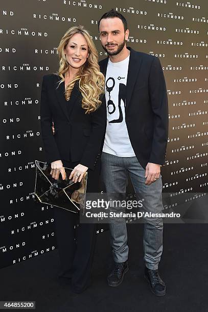 Silvia Slitti and Giampaolo Pazzini attend the John Richmond show during the Milan Fashion Week Autumn/Winter 2015 on March 1, 2015 in Milan, Italy.