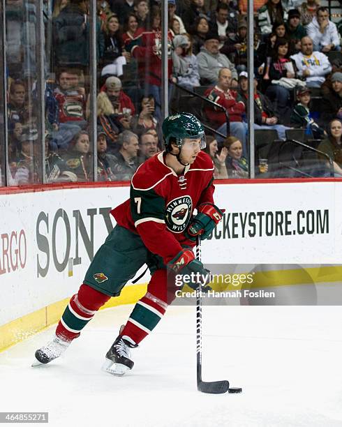 Jonathon Blum of the Minnesota Wild controls the puck during the game against the Colorado Avalanche on January 11, 2014 at Xcel Energy Center in St...