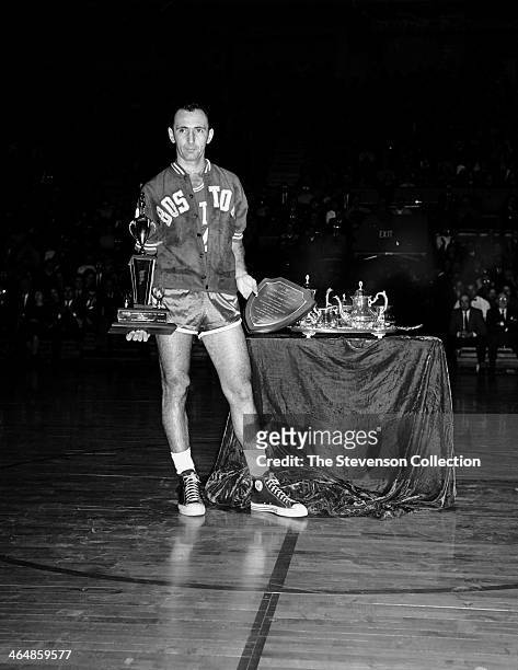 Bob Cousy of the Boston Celtics is presented a sports achievement award for his outstanding performance as a player and inspiration to the Youth of...