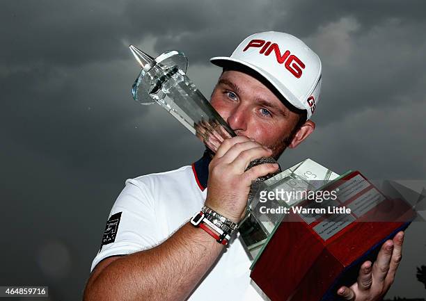 Andy Sullivan of England poses with the trophy after winning the Joburg Open at Royal Johannesburg and Kensington Golf Club on a score of -17 under...