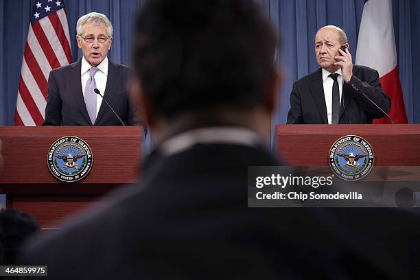 Defense Secretary Chuck Hagel and French Defense Minister Jean-Yves Le Drian hold a news conference at the Pentagon January 24, 2014 in Arlington,...