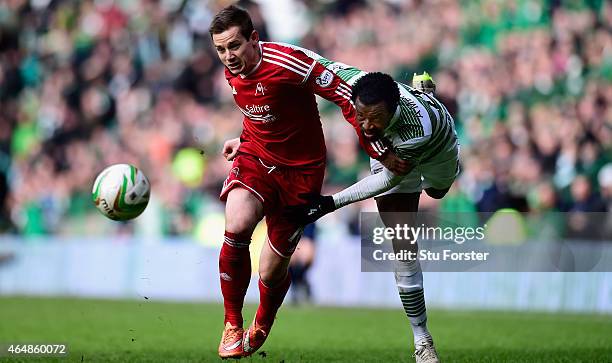 Celtic player Efe Ambrose is challenged by Peter Pawlett of Aberdeen during the Scottish Premiership match between Celtic and Aberdeen at Celtic Park...