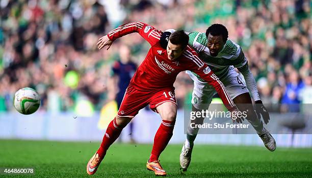 Celtic player Efe Ambrose is challenged by Peter Pawlett of Aberdeen during the Scottish Premiership match between Celtic and Aberdeen at Celtic Park...