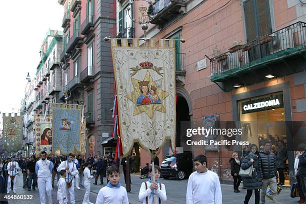 On the weeks that anticipate the religious rites of Holy Easter, the devotees of Madonna dell'Arco, marches through the streets of the city in...