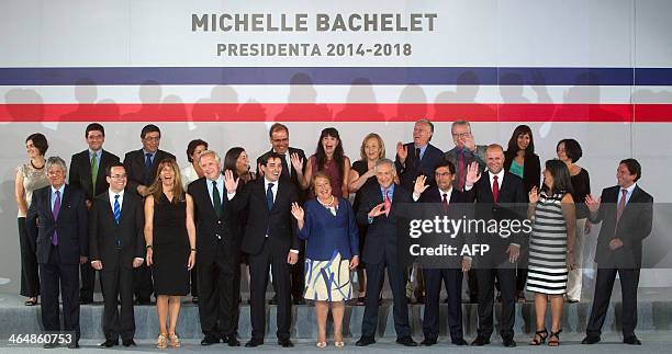 Chile's President-elect Michelle Bachelet , who takes office on March 11, poses with her new cabinet during the announcement-ceremony in Santiago, on...