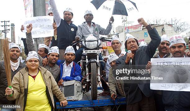 Activists staging protest on handcart against petrol price hike on March 1, 2015 in Indore, India. Petrol price hiked by Rs 3.18 per litre and diesel...