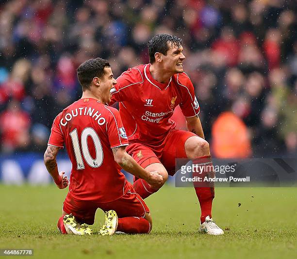 Philippe Coutinho of Liverpool celebrates with his team mates after his goal during the Barclays Premier League match between Liverpool and...