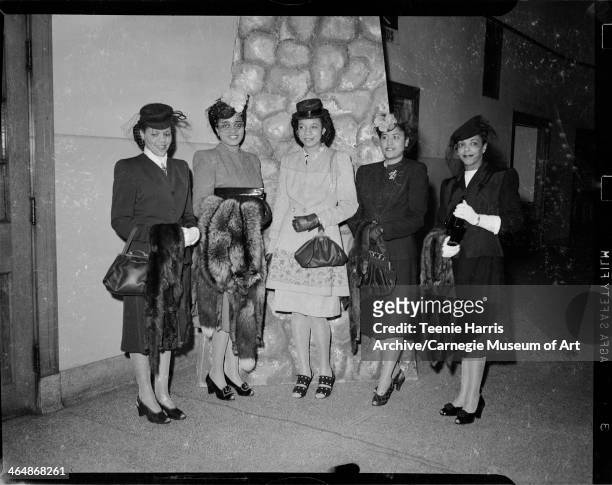 Emily King, E Bernice Coleman, Helen Delany, Sarah Moore, and Gladys Beverly, standing in front of painted stone backdrop, for Beauty Shop Owners'...