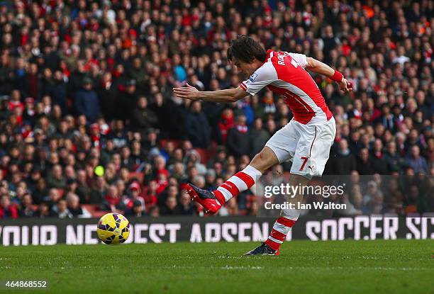 Tomas Rosicky of Arsenal scores their second goal during the Barclays Premier League match between Arsenal and Everton at Emirates Stadium on March...