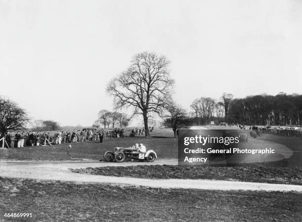 Competitors in the first ever race for cars to be held at the Donington Park circuit in Leicestershire, 25th March 1933. Gordon Casswell is leading...