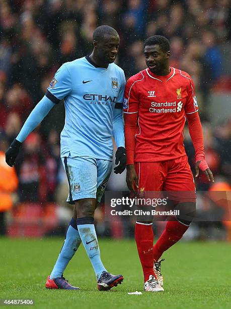 Yaya Toure of Manchester City and Kolo Toure of Liverpool walk off the pitch after the Barclays Premier League match between Liverpool and Manchester...