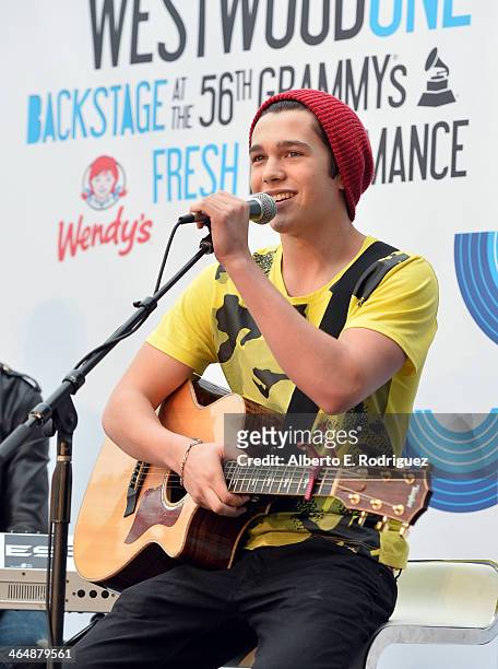 Musician Austin Mahone performs backstage at the GRAMMYs Westwood One Radio Remotes during the 56th GRAMMY Awards at the Staples Center Arena Club on...