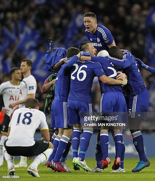 Chelsea's English defender Gary Cahill and Chelsea players celebrate at the final whistle in the English League Cup Final football match between...