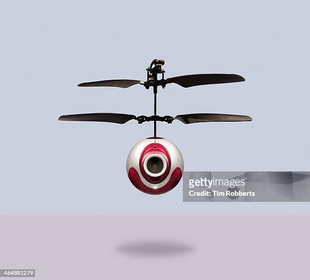 camera-drone hovering - flying drone stock-fotos und bilder