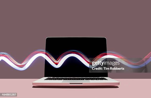 laptop with lightstreak. - broadband stock pictures, royalty-free photos & images