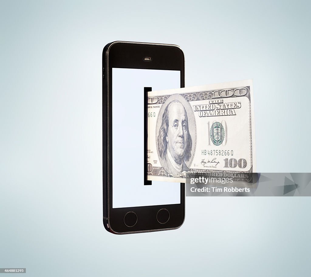 Smartphone dispensing 100 dollar bill.