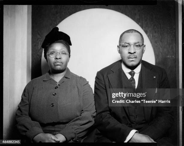 Josie Caldwell and Samuel Caldwell posed in front of circular background, in Harris Studio, Pittsburgh, Pennsylvania, 1945.