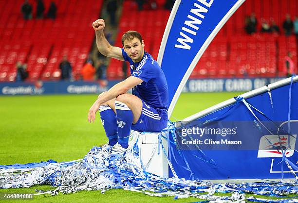 Branislav Ivanovic of Chelsea sits on the winners podium after the Capital One Cup Final match between Chelsea and Tottenham Hotspur at Wembley...
