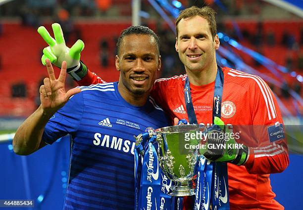 Three times winners of the competition, Chelsea's Ivorian striker Didier Drogba and Chelsea's Czech goalkeeper Petr Cech celebrate with the trophy...
