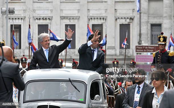 The president of Uruguay, Tabaré Vázquez and vice president Raul Sendic greet the public from the vehicle that takes them from the Parliament toward...