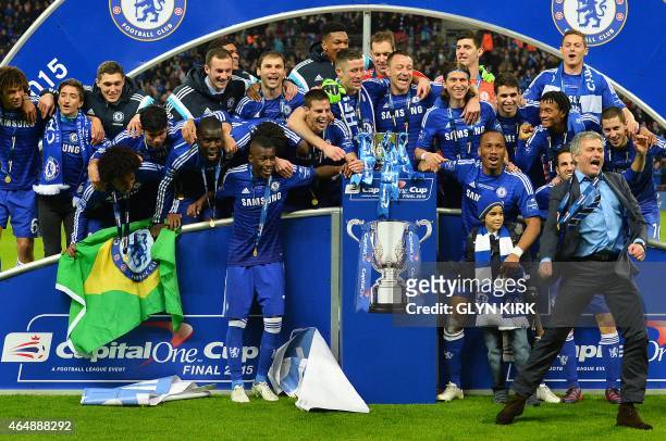 Chelsea's Portuguese manager Jose Mourinho celebrates with his team during the presentation after Chelsea won the League Cup final football match...