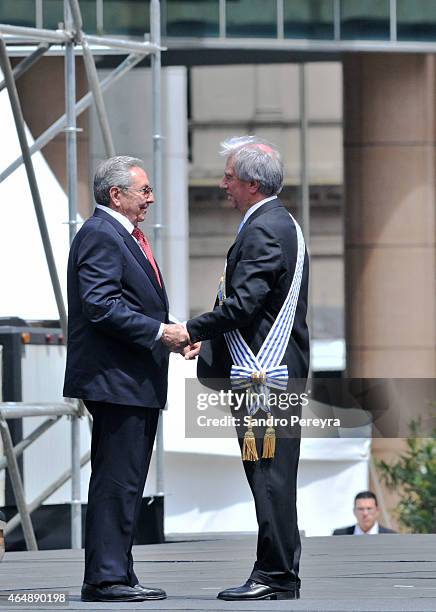 Raúl Castro, president of Cuba presents his compliments to the new president of Uruguay, Tabaré Vázquez, at Independence Square in Montevideo on...