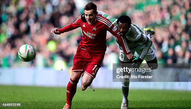 Celtic player Efe Ambrose is challenged by Peter Pawlett of Aberdeen during the Scottish Premiership match between Celtic and Aberdeen at Celtic Park...