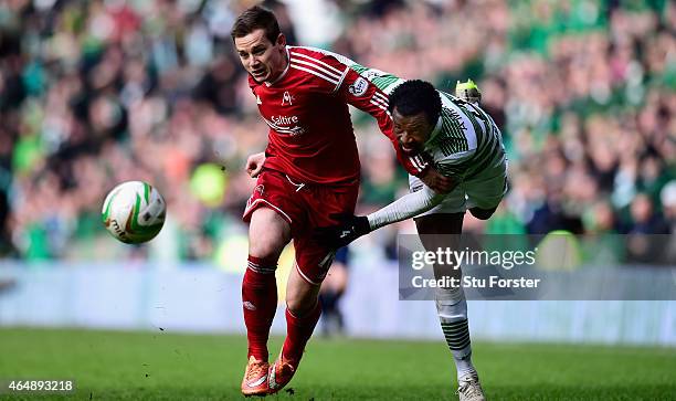 Celtic player Efe Ambrose is challenged by Peter Pawlett of Aberdeen during the Scottish Premiership match between Celtic and Aberdeen at Celtic Park...