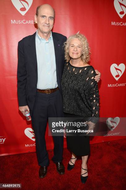 Recording artist James Taylor and honoree Carole King attend 2014 MusiCares Person Of The Year Honoring Carole King at Los Angeles Convention Center...