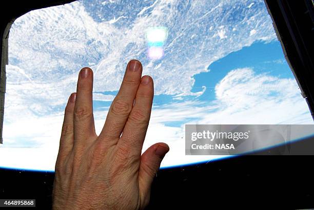In this handout from NASA, International Space Station astronaut Terry Virts make the Vulcan salute from "Star Trek" and the character Spock,, who...
