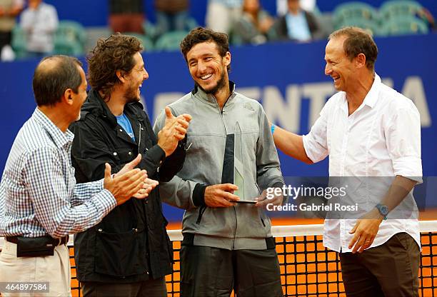 Martin Jaite, Juan Monaco and Gaston Gaudio laugh during the award ceremony after a singles final match between Rafael Nadal of Spain and Juan Monaco...