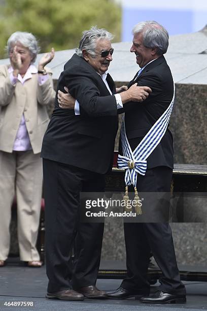 Outgoing Uruguayan President Jose Mujica delivers the Presidential sash to new President Tabare Vazquez during the Vazquez investiture ceremony at...
