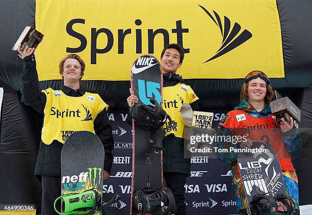 Taylor Gold in second place, Yiwei Zhang of China in first place and Kent Callister of Australia celebrate on the podium after winning the FIS...