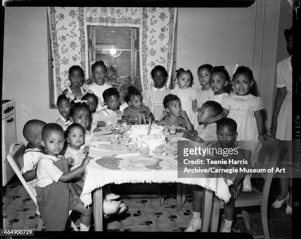 Birthday party for Anthony and Dennis Farrell, surrounded by Melvin Roberts Jr, Claudine Lorraine and Harold Wright Jr, Marie and Sherman Watson Jr,...