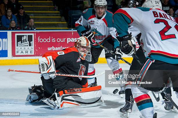 Marek Langhamer of the Medicine Hat Tigers defends the net and makes a save against the Kelowna Rockets on January 24, 2014 at Prospera Place in...