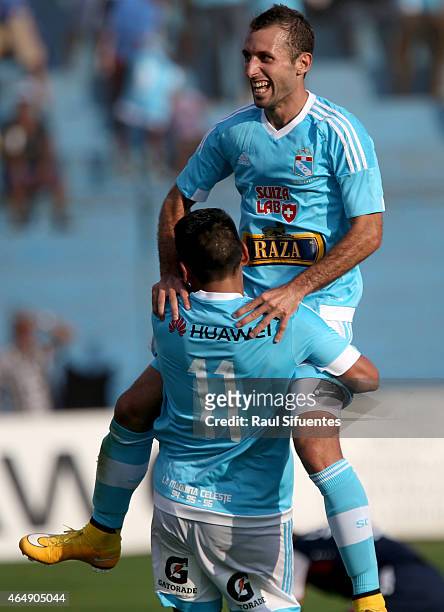 Horacio Calcaterra of Sporting Cristal celebrates with his teammate after scoring the second goal of his team against San Martin during a match...