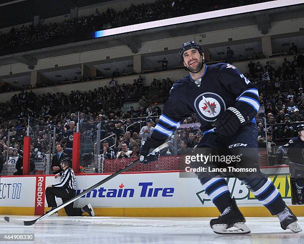 Jay Harrison of the Winnipeg Jets hits the ice prior to puck drop against the Dallas Stars on February 24, 2015 at the MTS Centre in Winnipeg,...