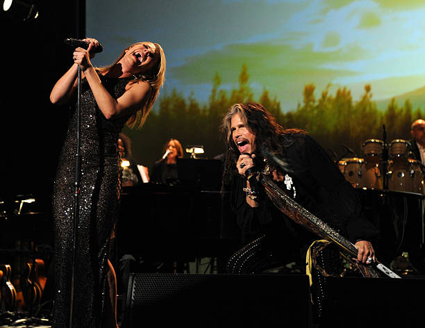 LeAnn Rimes and Steven Tyler perform onstage at 2014 MusiCares Person Of The Year Honoring Carole King at Los Angeles Convention Center on January...