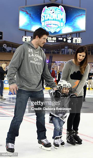 Colin Fraser of the Los Angeles Kings skates with his family as part of the 2014 Coors Light NHL Stadium Series against the Anaheim Ducks at Dodger...