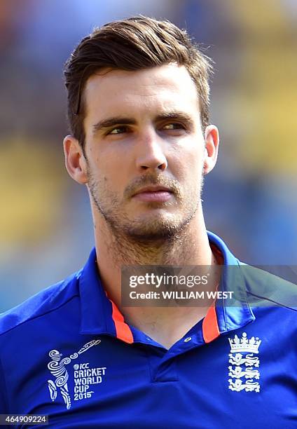 In this picture taken on March 1 England fast bowler Steve Finn stands for the national anthems before the start of the 2015 Cricket World Cup Group...