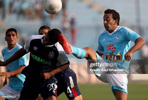 Sergio Blanco of Sporting Cristal struggles for the ball with Wilder Cartagena of San Martin during a match between Sporting Cristal and San Martin...