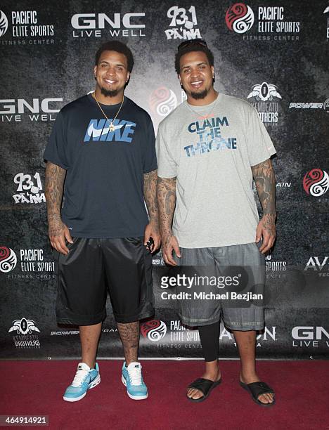 Players Mike Pouncey and Maurkice Pouncey attend the Pacific Elite Sports Fitness Center Grand Opening on January 24, 2014 in Kaneohe, Hawaii.
