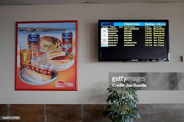 Departure screen shows times for the five Miami-bound charter flights in the terminal at José Martí International Airport on March 1, 2015 in Havana,...