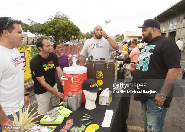 Former NFL players Maake Kemoeatu and Chris Kemoeatu try the refreshments at the Pacific Elite Sports Fitness Center Grand Opening on January 24,...