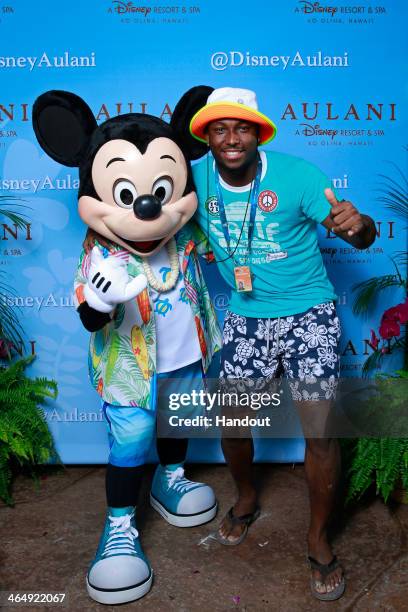 Pro Bowl running back LeSean McCoy of the Philadelphia Eagles gets in the Aloha spirit with Mickey Mouse during a NFLPA Pro Bowl players reception at...