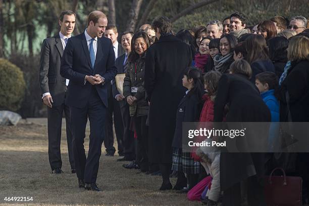 Prince William, Duke of Cambridge speaks with people at the British Ambassador's official residence on March 2, 2015 in Beijing, China. The Duke of...