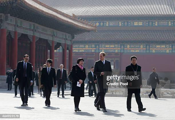 Prince William, Duke of Cambridge is guided by Chinese officials as he tours the Forbidden City on March 2, 2015 in Beijing, China. The Duke of...